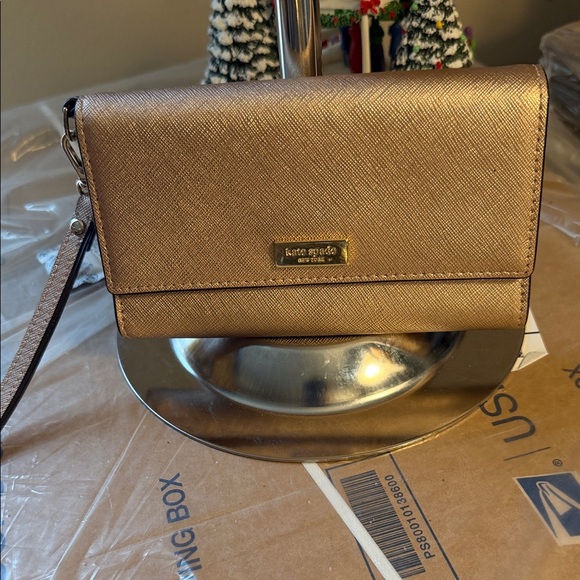 kate spade Handbags - Kate Spade Gold Textured Wristlet